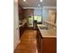 Stylish kitchen featuring stainless steel appliances, wood cabinets, and tile backsplash at 4036 Carlinswood Way, Stone Mountain, GA 30083