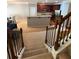 Open-concept living space with a staircase, kitchen, and dining area at 4036 Carlinswood Way, Stone Mountain, GA 30083