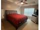 Spacious main bedroom with tray ceiling, fan, large window, and en suite at 4036 Carlinswood Way, Stone Mountain, GA 30083