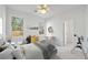 A bedroom with natural light, neutral colors, and whimsical decor at 4185 Waterford Dr, Suwanee, GA 30024