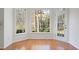 Breakfast nook features large windows, hardwood floors and a door to the outside at 4185 Waterford Dr, Suwanee, GA 30024