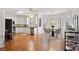 Open kitchen featuring modern appliances, white cabinets, granite countertops, and an eat-in area at 4185 Waterford Dr, Suwanee, GA 30024
