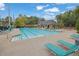 Enjoy the community's outdoor pool with plenty of lounge chairs and tables for relaxing by the water at 4185 Waterford Dr, Suwanee, GA 30024