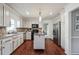 Bright kitchen featuring white cabinets, stainless steel appliances, granite countertops and hardwood floors at 2597 Oak Village Ne Pl, Marietta, GA 30062