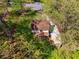 Aerial view of a home with an expansive backyard, deck, mature trees, and a long paved drive at 388 Pine Trl, Canton, GA 30115