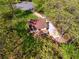 Aerial view of the property showing its beautiful landscaping, deck, driveway and surrounding mature trees at 388 Pine Trl, Canton, GA 30115