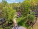 Charming home with a well-manicured lawn, mature trees, and a welcoming front porch at 388 Pine Trl, Canton, GA 30115