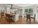 Bright kitchen with island seating and a view to the breakfast nook and back deck at 388 Pine Trl, Canton, GA 30115