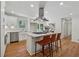 Open kitchen with white cabinetry, stainless appliances, and a center island with seating at 388 Pine Trl, Canton, GA 30115