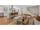 Open concept living space with modern kitchen, comfortable seating, and hardwood floors at 388 Pine Trl, Canton, GA 30115