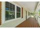 Inviting porch features stained wood decking and railings for relaxing outside at 388 Pine Trl, Canton, GA 30115