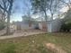 View of the backyard featuring a concrete patio, gray siding, and verdant trees at 4262 Lindsey Dr, Decatur, GA 30035