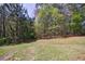 The spacious back yard features a lush lawn with natural surroundings, perfect for outdoor activities at 6340 Hickory Lane Cir, Union City, GA 30291