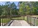 A spacious back yard features a wood deck and lush lawn with ample privacy at 6340 Hickory Lane Cir, Union City, GA 30291