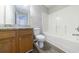 Bathroom featuring a modern vanity, granite counters, and a shower-tub combo at 6340 Hickory Lane Cir, Union City, GA 30291