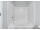 Bathtub with white tile surround and chrome shower head at 6340 Hickory Lane Cir, Union City, GA 30291