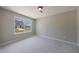 Bright bedroom featuring a large window overlooking the front yard at 6340 Hickory Lane Cir, Union City, GA 30291