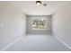 Comfortable bedroom with neutral walls, carpet, and a large window providing natural light at 6340 Hickory Lane Cir, Union City, GA 30291