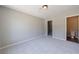 Spacious carpeted bedroom featuring a walk-in closet and an adjacent bathroom at 6340 Hickory Lane Cir, Union City, GA 30291