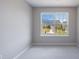 A bright bedroom offers plush carpeting and a large window, providing lots of natural light at 6340 Hickory Lane Cir, Union City, GA 30291