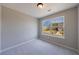 A bright bedroom offers plush carpeting and a large window, providing lots of natural light at 6340 Hickory Lane Cir, Union City, GA 30291