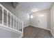Welcoming entryway featuring hardwood-style floors and a classic white staircase at 6340 Hickory Lane Cir, Union City, GA 30291