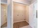 Laundry room with hardwood-style floor and closet with shelving at 6340 Hickory Lane Cir, Union City, GA 30291