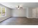 Spacious living room with hardwood floors, ceiling fan, and natural light at 6340 Hickory Lane Cir, Union City, GA 30291