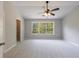 Bright main bedroom with a ceiling fan, large window, and walk in closet at 6340 Hickory Lane Cir, Union City, GA 30291