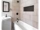 Nicely remodeled bathroom featuring a modern vanity, sleek fixtures, and tiled shower at 3036 Crabapple Cir, Decatur, GA 30034