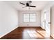 Bright bedroom with hardwood floors, ceiling fan, and plenty of natural light from the window at 3036 Crabapple Cir, Decatur, GA 30034