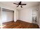 Bedroom with a ceiling fan, closet, and door leading to the bathroom at 3036 Crabapple Cir, Decatur, GA 30034