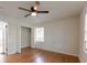 Bedroom with hardwood floors, a ceiling fan, a window, and bi-fold closet doors at 3036 Crabapple Cir, Decatur, GA 30034