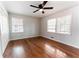 Bedroom featuring hardwood floors and two windows providing natural light at 3036 Crabapple Cir, Decatur, GA 30034