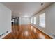 Open-concept living room with hardwood floors, modern lighting, and large windows with great natural light at 3036 Crabapple Cir, Decatur, GA 30034