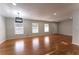 Open-concept living room with hardwood floors, recessed lighting, and lots of natural light at 3036 Crabapple Cir, Decatur, GA 30034