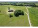 Expansive green acreage featuring a stunning home and winding driveway at 5187 Parkview Rd, Social Circle, GA 30025