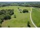 Beautiful aerial view showcasing the house on a vast, green, treed lot at 5187 Parkview Rd, Social Circle, GA 30025