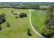 Aerial view showcases home with long driveway on sprawling land at 5187 Parkview Rd, Social Circle, GA 30025