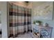Bathroom featuring tiled walls, patterned shower curtain, and decorative vanity at 5187 Parkview Rd, Social Circle, GA 30025