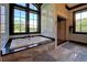 Spa-like bathroom retreat featuring a soaking tub, walk-in shower, and natural light at 5187 Parkview Rd, Social Circle, GA 30025