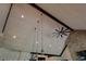 High vaulted ceilings with exposed beams and modern lighting fixtures at 5187 Parkview Rd, Social Circle, GA 30025
