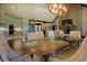 Open-concept dining area with views of the kitchen and living room, perfect for entertaining guests at 5187 Parkview Rd, Social Circle, GA 30025