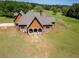 Craftsman home boasts stone and siding accents with a beautiful, well-maintained lawn at 5187 Parkview Rd, Social Circle, GA 30025