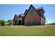 Charming home with stone and cedar shake exterior, archway entry, and meticulously maintained lawn at 5187 Parkview Rd, Social Circle, GA 30025