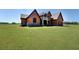 Gorgeous home with stone and wood exterior on a spacious lawn at 5187 Parkview Rd, Social Circle, GA 30025