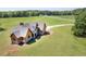 Stunning home with stone accents, stylish architectural design, and lush lawn at 5187 Parkview Rd, Social Circle, GA 30025