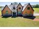 Elegant exterior with beautiful windows and landscaping at 5187 Parkview Rd, Social Circle, GA 30025