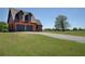 Sprawling grounds feature a charming home and large detached garage, surrounded by lush, manicured lawns at 5187 Parkview Rd, Social Circle, GA 30025