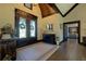Elegant foyer featuring wood floors, soaring ceilings, decorative wreaths, and stylish furnishings at 5187 Parkview Rd, Social Circle, GA 30025